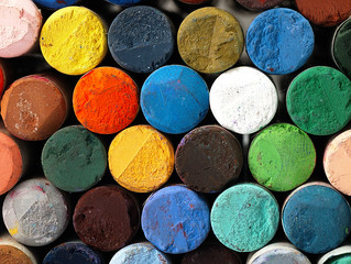Colored dry pastel crayons closely.
