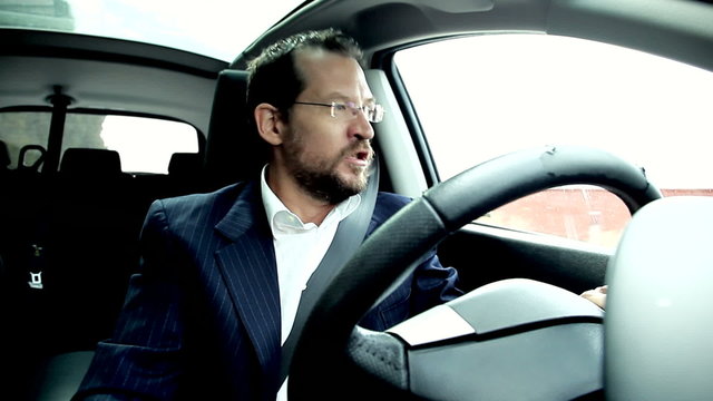 Angry business man shouting stock in traffic