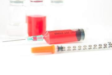 Disposable syringe and injection vials background