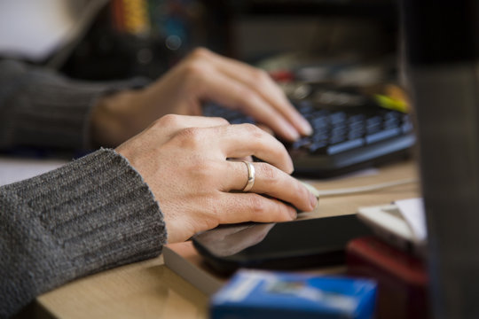 Woman Hands Touching Mouse and Keyboard on Table