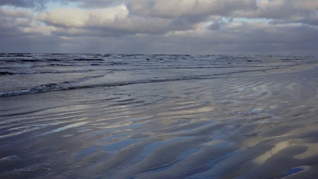 Sea in December storms and waves beat against the shore