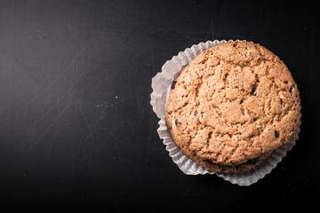 Oat cookies on the old shabby background. tinted. with space for