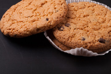 Oat cookies on the old shabby background. tinted. with space for