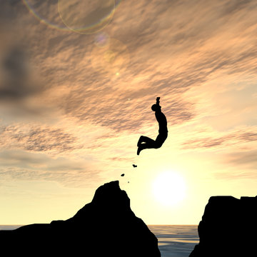 Human man silhouette jumping at sunset