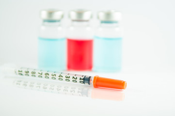 Disposable syringe and injection vial background