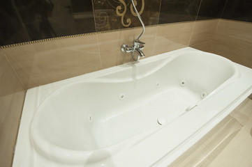 Luxury bath tub in apartment bathroom
