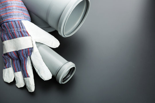 Building glove and soil-pipe on grey