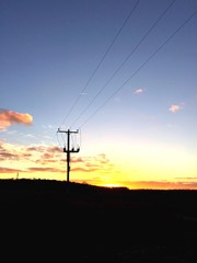 electricity pylon against the sunset in england