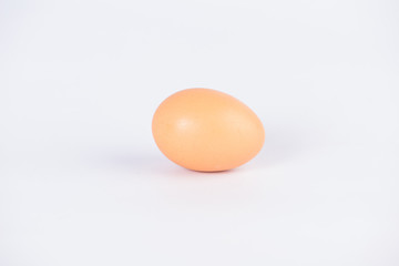 close up of egg on white background