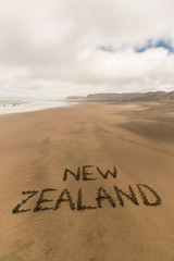 handwriting in sand on New Zealand coast