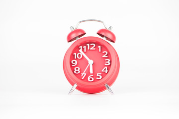 Red alarm clock on white