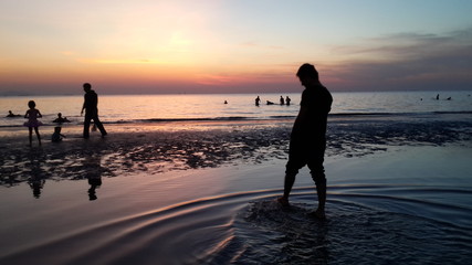 Fototapeta premium A man walking on the beach