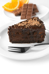 Yummy chocolate cake served on table
