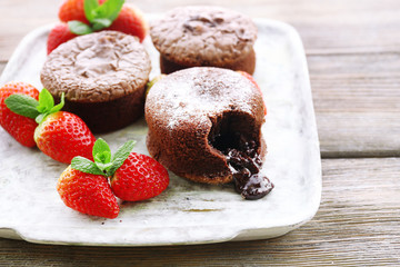 Hot chocolate pudding with fondant centre with strawberries,