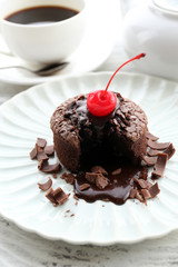 Hot chocolate pudding with fondant centre on plate, close-up