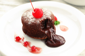 Hot chocolate pudding with fondant centre on plate, close-up