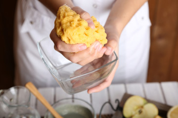 Beautician makes cosmetic facial masks, close-up,