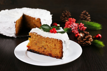 Slice of cake covered cream with Christmas decoration