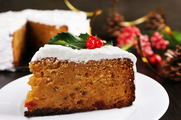 Slice of cake covered cream with Christmas decoration