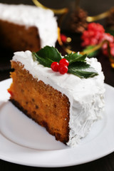 Slice of cake covered cream with Christmas decoration