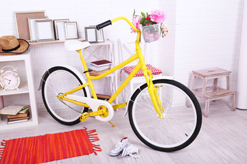 Fototapeta na wymiar Yellow retro bicycle in spacious bright room