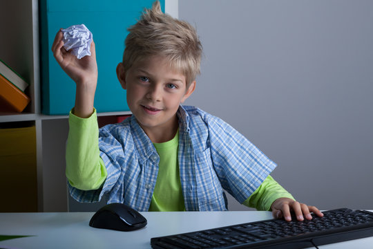 Boy Throwing Ball Of Paper