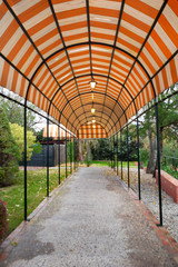 Covered pathway with lanterns