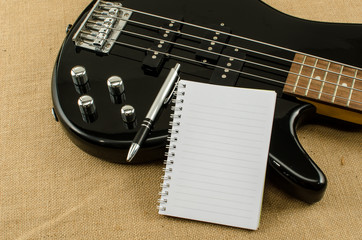 Fototapeta premium white paper on electric bass guitar