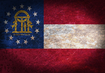 Old rusty metal sign with a flag