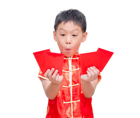 Asian boy with Chinese traditional dress  holding ang pow or red
