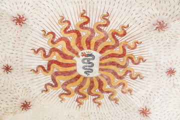 Painted coat of arms with dragon on ceiling