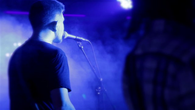 Lead singer performs on stage