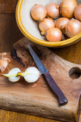 Fototapeta na wymiar onion cutting on wooden board