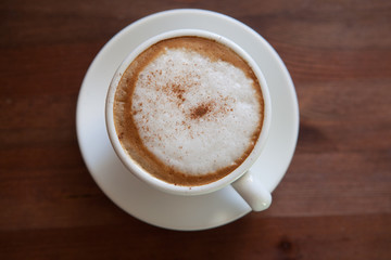 Cappuccino cup with coffee beans