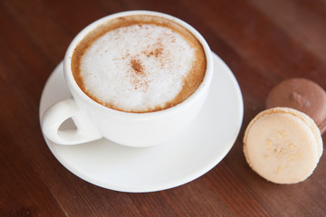 Cappuccino cup with coffee beans