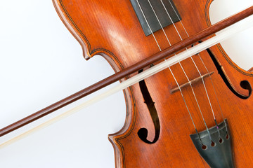 Violin with a bow on a white background