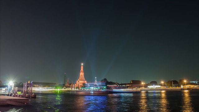 Timelapse at night of Wat Arun with lighting show near Chaopraya river,Bangkok Thailand