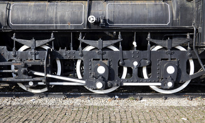 Grunge old steam locomotive wheel and rods