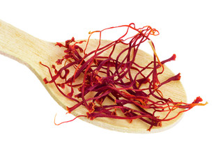 Fototapeta premium Saffron spice on small wooden spoon, macro isolated on white bac