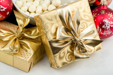 christmas decoration and golden box with ribbon