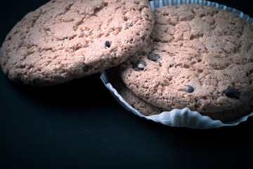 Oat cookies on the old shabby background. tinted. with space for