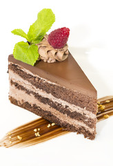 Prague piece of cake decorated with raspberries