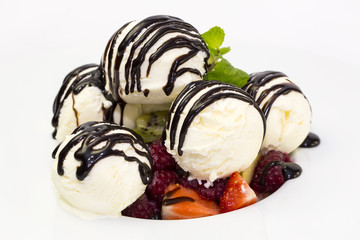 fruit salad and ice cream on white background