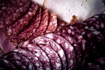 Fototapeta premium The background - detail of sliced salami