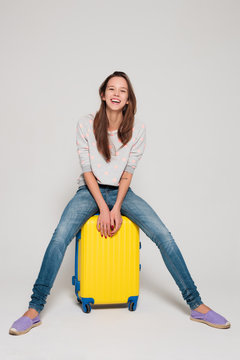 Girl with a yellow suitcase