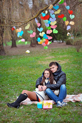 lovers walking in the park in spring decor paper hearts