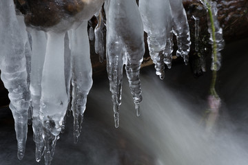 Icicles on the water.Small depth of field.