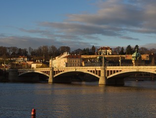 Fototapeta na wymiar Riverbank and bridge of old town in Prague
