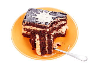 Chocolate cake on orange plate