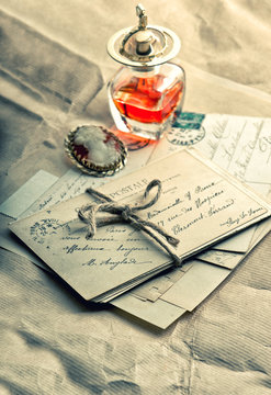 old love letters, antique accessories, perfume and cameo
